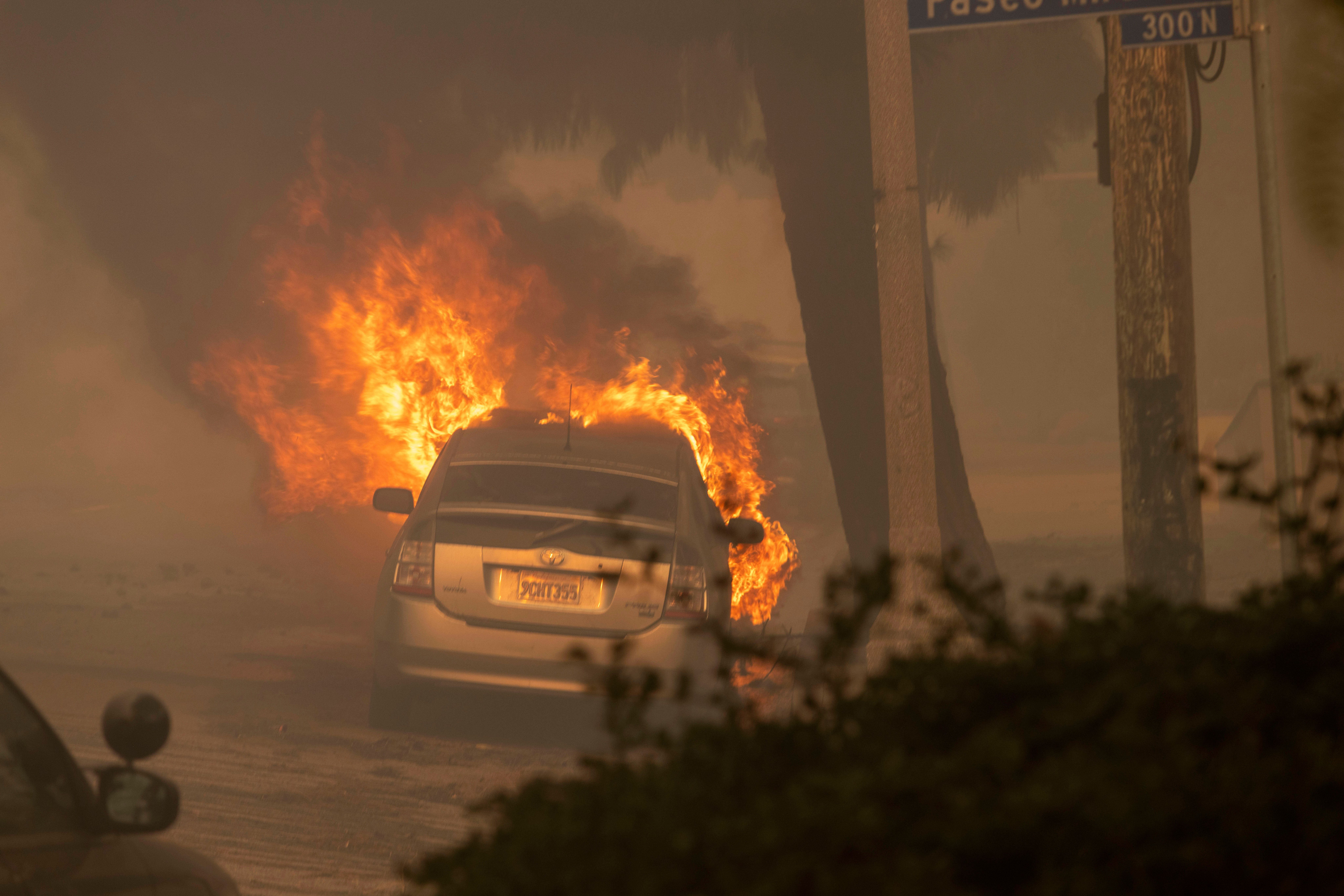 Firefighters Are Having to Bulldoze Cars off the Road in Palisades Fire