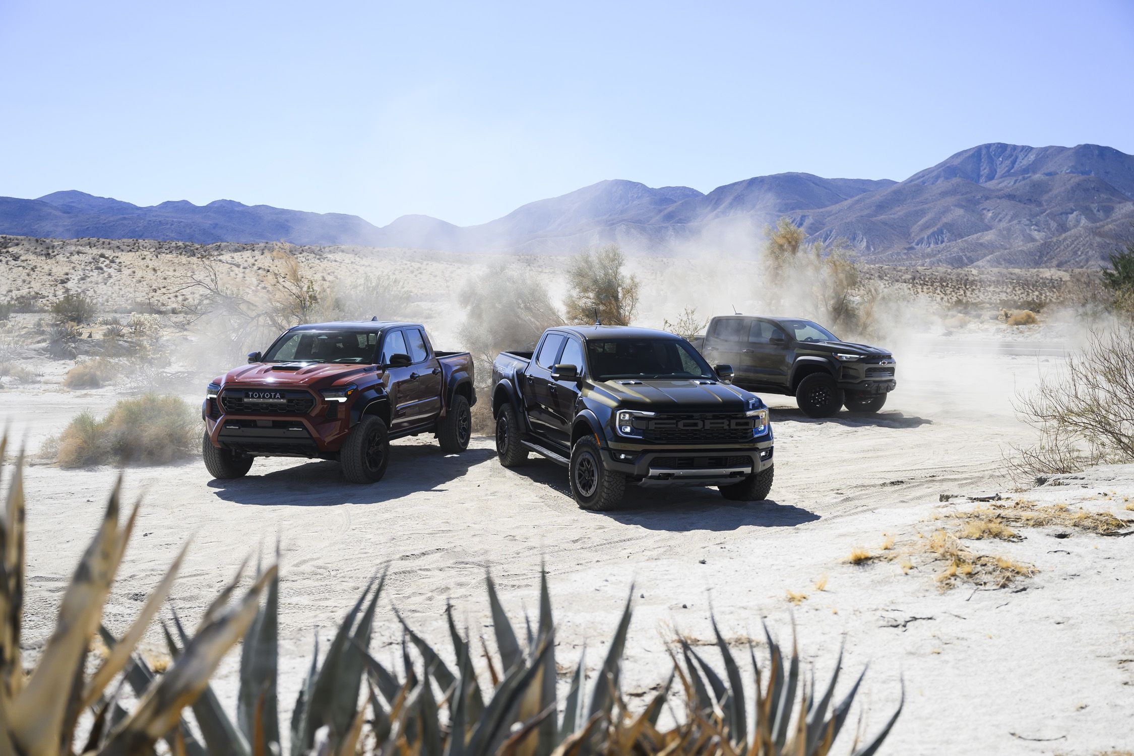 View Exterior Photos of the 2025 Chevrolet Colorado ZR2 Bison, 2024 Ford Ranger Raptor, and 2024 Toyota Tacoma TRD Pro