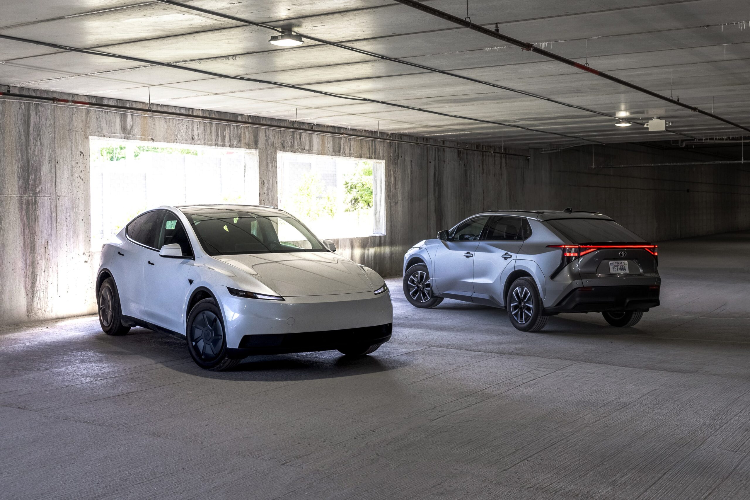 2026 Tesla Model Y vs. 2026 Toyota bZ Comparison Test: Two Bestsellers, One Winner