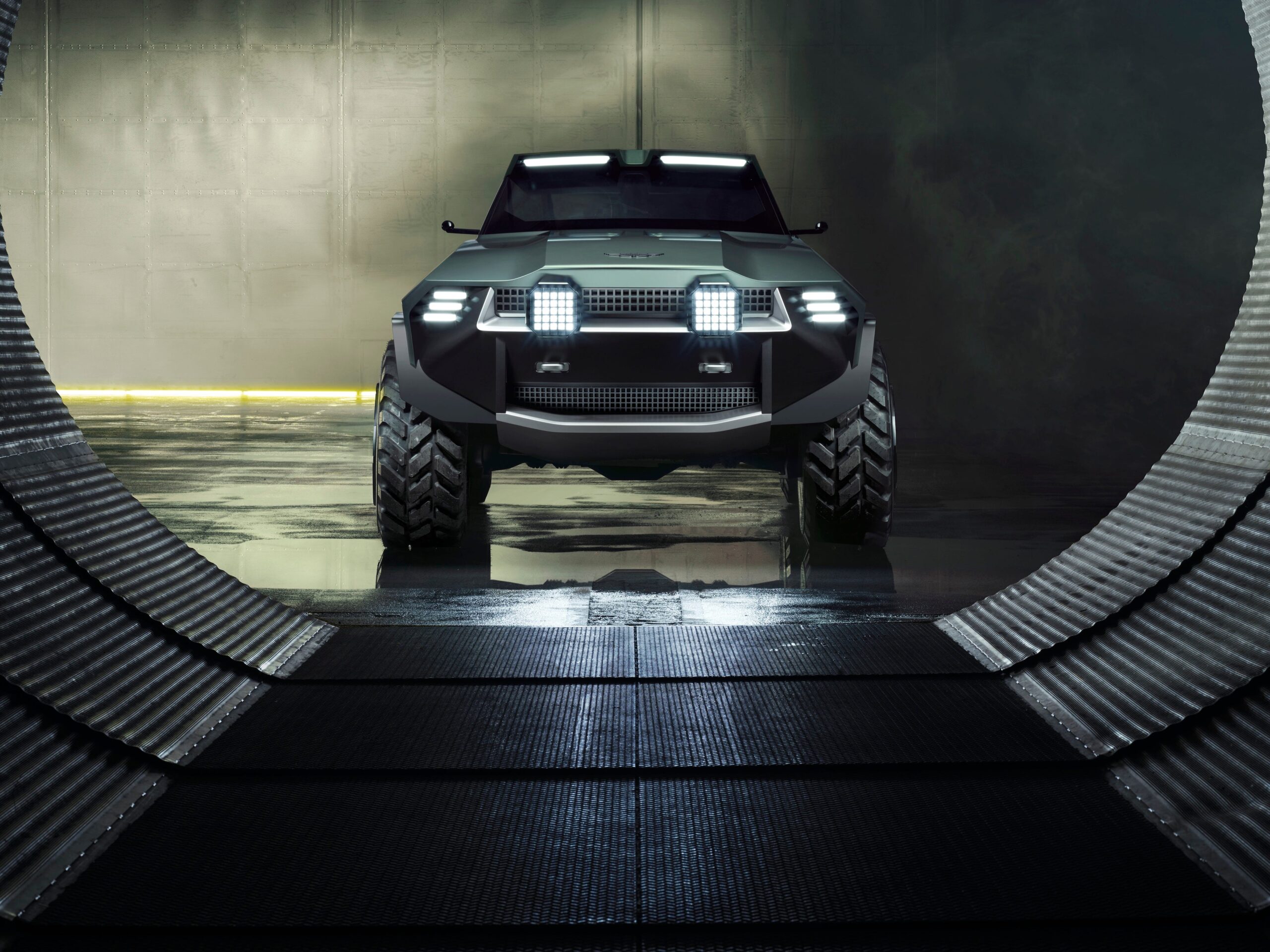 This Crazy V-12-Powered Aston Martin SUV Is Ready for Battle